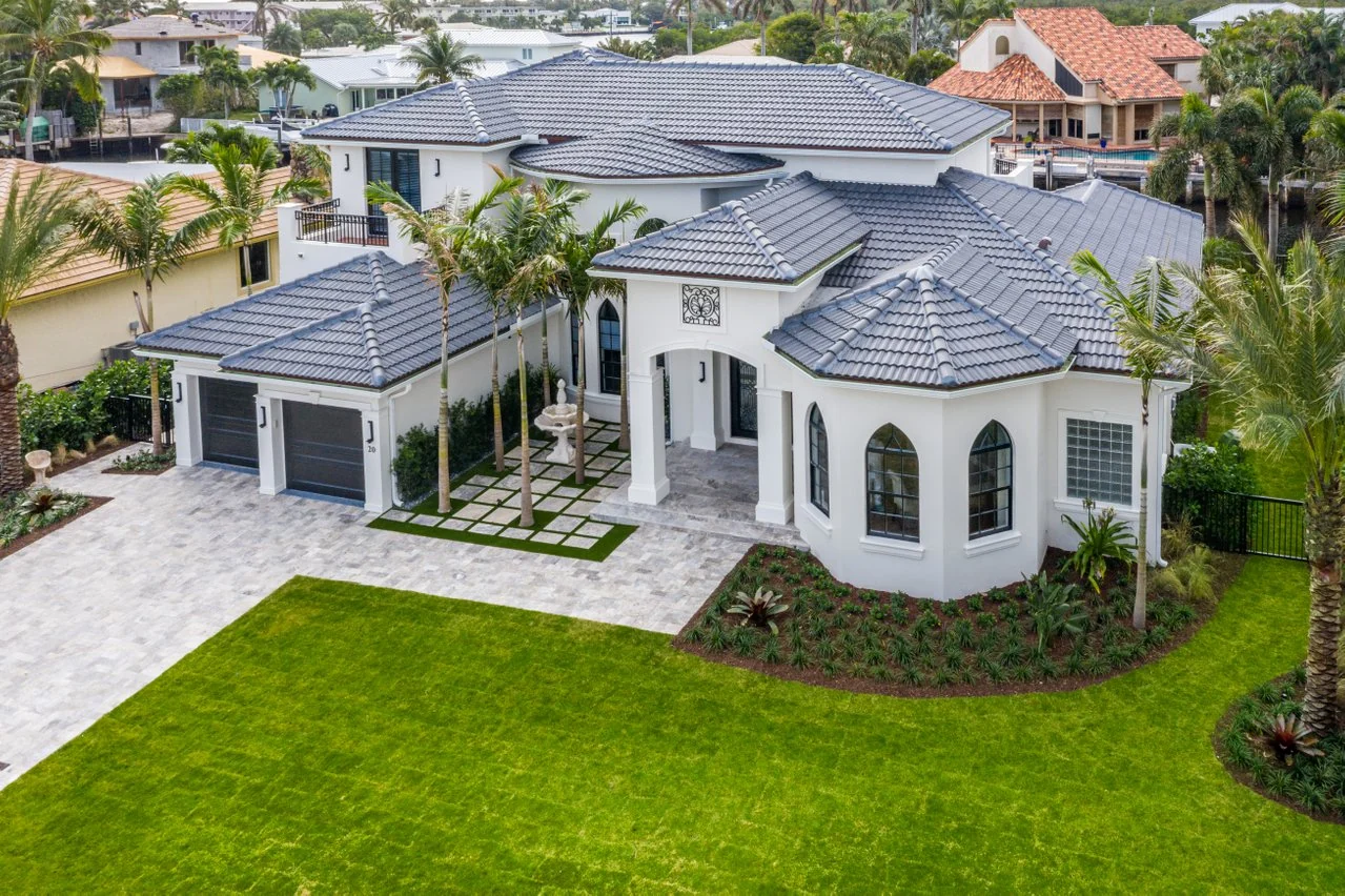 Aerial view of a completed interlocking paver driveway at a Palm Beach County home