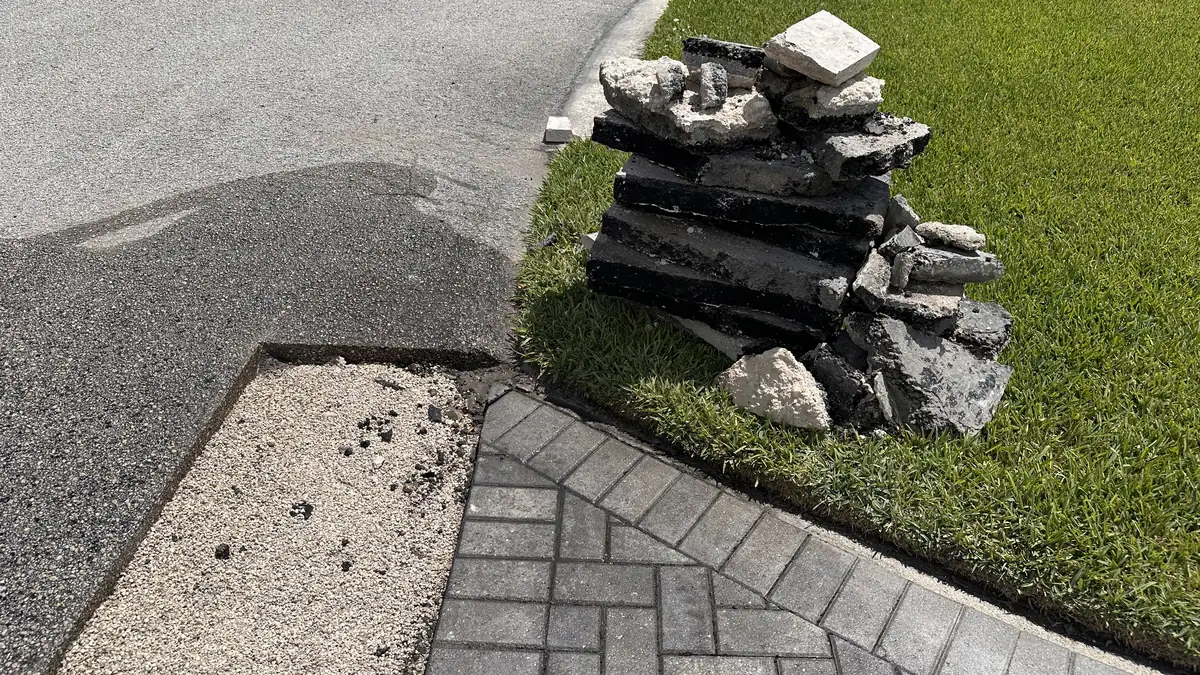 Exposed support area prepared for the driveway asphalt transition repair