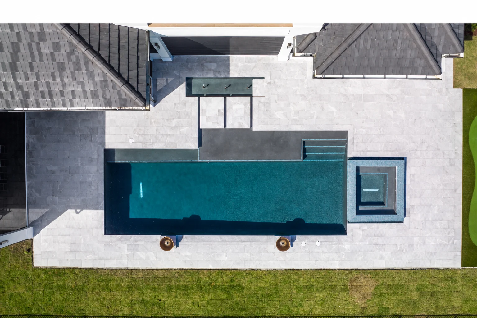 Aerial view of a completed pool deck by Palm Beach Pavers in Palm Beach County, Florida